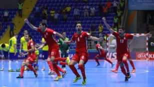Iran futsal team celebrates after winning on penalty kicks against Brazil at the FIFA Futsal World Cup 2016 in Colombia (Photo by Victor Decolongon - FIFA via Getty Images)