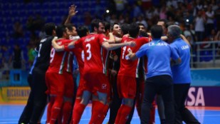 Team Iran celebrate on the court after their quarterfinal match against Paraguay at the 2016 FIFA Futsal World Cup in Colombia (Photo by Victor Decolongon - FIFA via Getty Images)