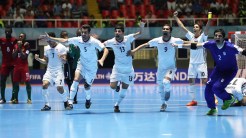 Iran futsal team celebrates after winning on penalty kicks against Portugal at the FIFA Futsal World Cup 2016 in Colombia (Photo by Ian MacNicol - FIFA via Getty Images)